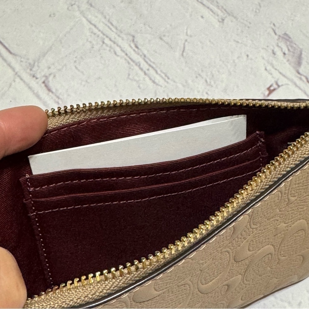 Coach Corner Zip Wristlet in Taupe grain leather with Signature C’s all over Nwt - Picture 3 of 7